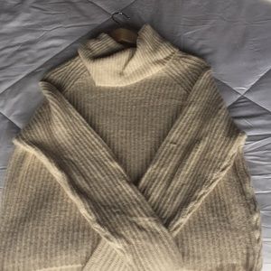 Pull col roulé beige Garage